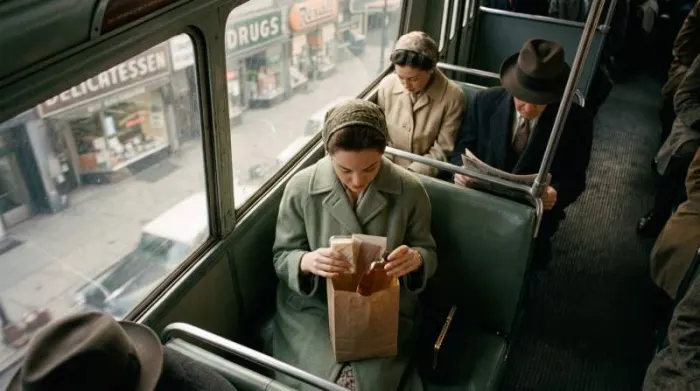 1950s woman carrying bath oil as an accessible everyday fragrance purchase