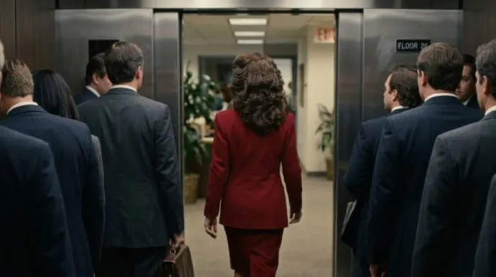 Woman with big 1980s hair wearing red power blazer Woman with big 1980s hair wearing red power blazer