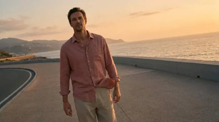 Modern man wearing soft open shirt showing relaxed confidence without macho styling Modern man wearing soft open shirt showing relaxed confidence without macho styling