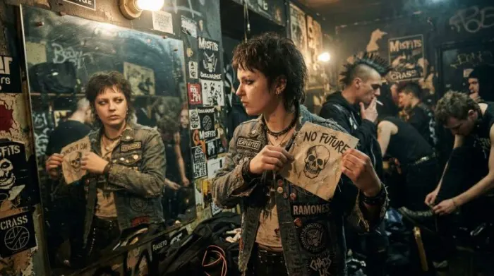 Punk dressing room scene with ripped denim and safety pins showing DIY fashion turning scarcity into identity