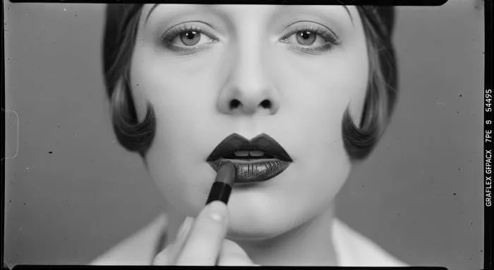 1920s flapper makeup featuring dark sculpted cupid bow lips inspired by Clara Bow