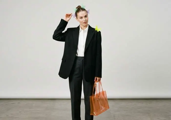 Single minimalist butterfly clip on styled hair for refined Y2K look